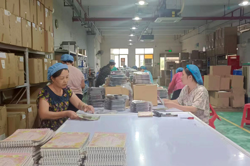 Employees are packing products on the assembly line